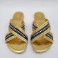 Pair of gold sandals with denim blue straps 