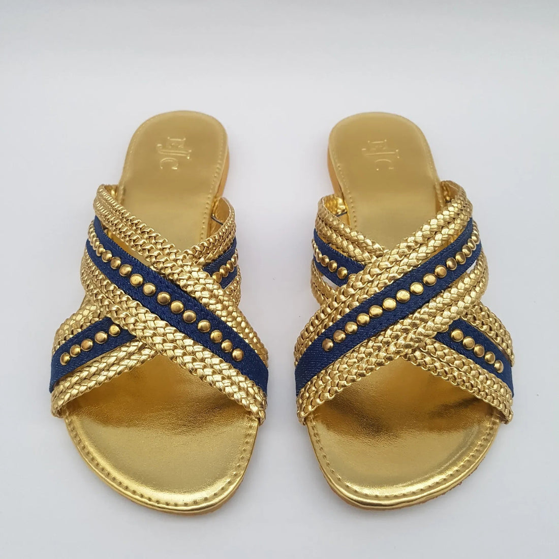 Pair of gold sandals with denim blue straps 