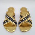 Pair of gold sandals with denim blue straps 