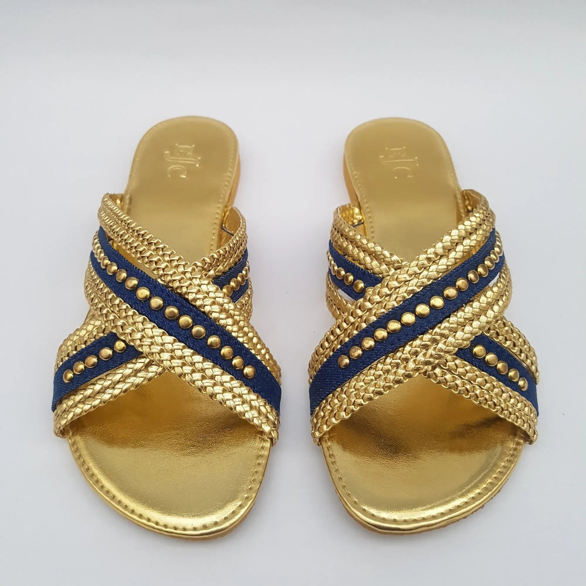 Pair of gold sandals with denim blue straps 