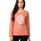 Woman wearing a coral sweatshirt with text on a plain background