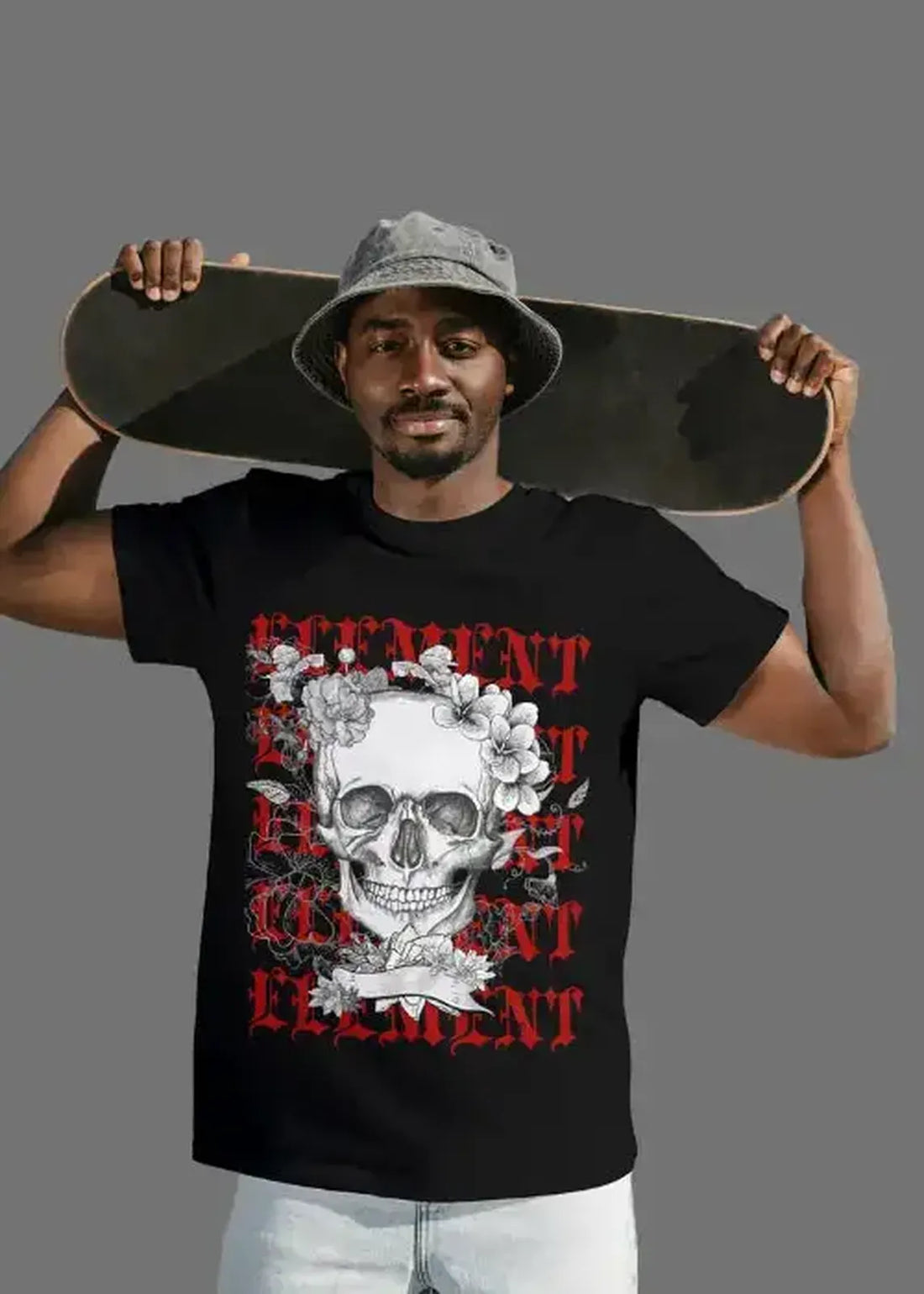 Man wearing a black t-shirt with a skull design and text, holding a skateboard.