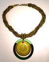 A green wooden pendant necklace with matching bead string, featuring an adjustable closure.