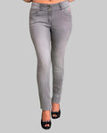 Gray jeans worn by a person on a gray background