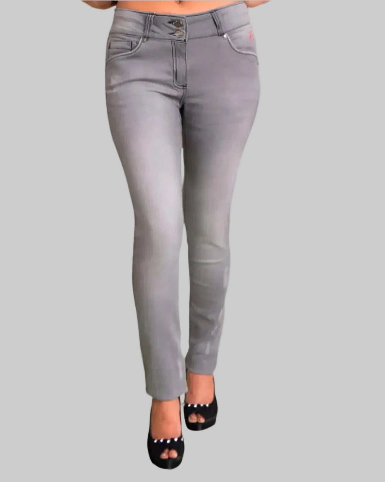 Gray jeans worn by a person on a gray background