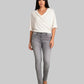 Woman wearing a white top and gray pants on a gray background