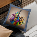 Decorative pillow with a colorful guitar and musical notes design on a couch.