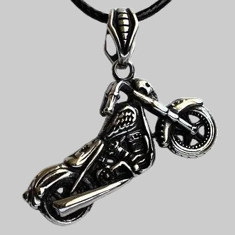 Motorcycle-shaped pendant on a gray background