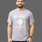 Person wearing a gray t-shirt with white text and logo on a plain background