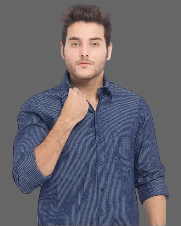 Man wearing a blue checkered shirt against a white background