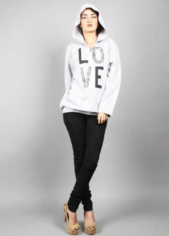 Person wearing a white hoodie with 'LOVE' printed on it against a gray background