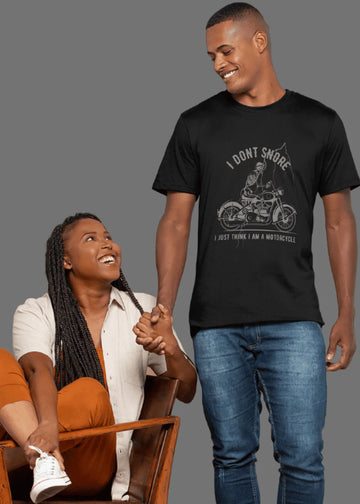Man wearing a black t-shirt with a graphic design and text, standing next to a woman.