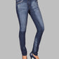 Blue jeans worn by a person on a gray background