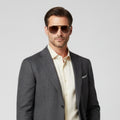 Aviator sunglasses with brown lenses on a white background