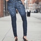 Person wearing blue jeans on a city street