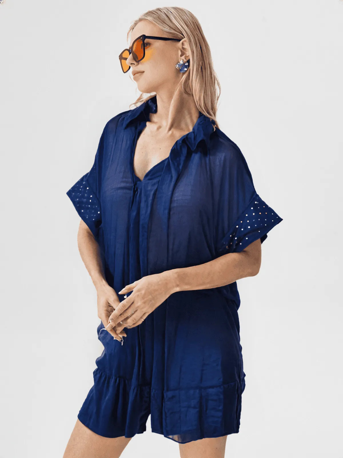 Loose fit short sleeve linen shirt with ruffle front.