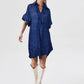Loose fit short sleeve linen shirt with ruffle front.