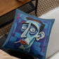 Decorative pillow with a stylized face design on a couch