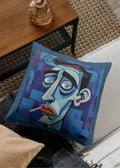 Decorative pillow with a stylized face design on a couch
