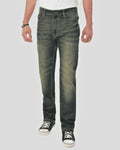 Person wearing dark green jeans on a white background