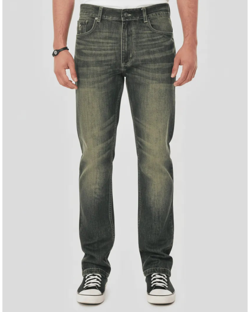 Person wearing dark jeans and black sneakers on a white background