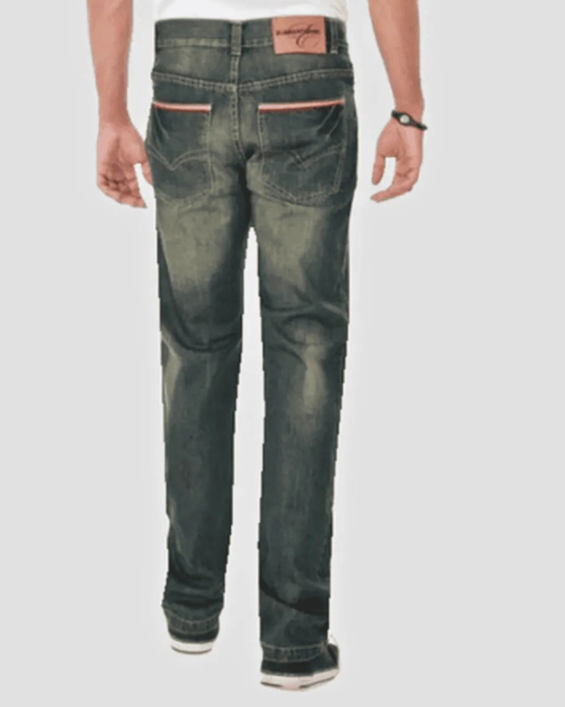 Person wearing dark green distressed jeans on a white background