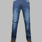 Blue jeans with slight distressing on a gray background
