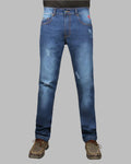 Blue jeans with slight distressing on a gray background