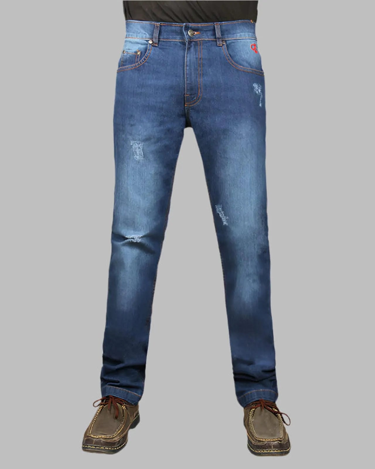 Blue jeans with slight distressing on a gray background