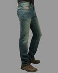 Blue jeans worn by a person on a gray background
