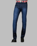 Blue jeans worn by a person on a gray background
