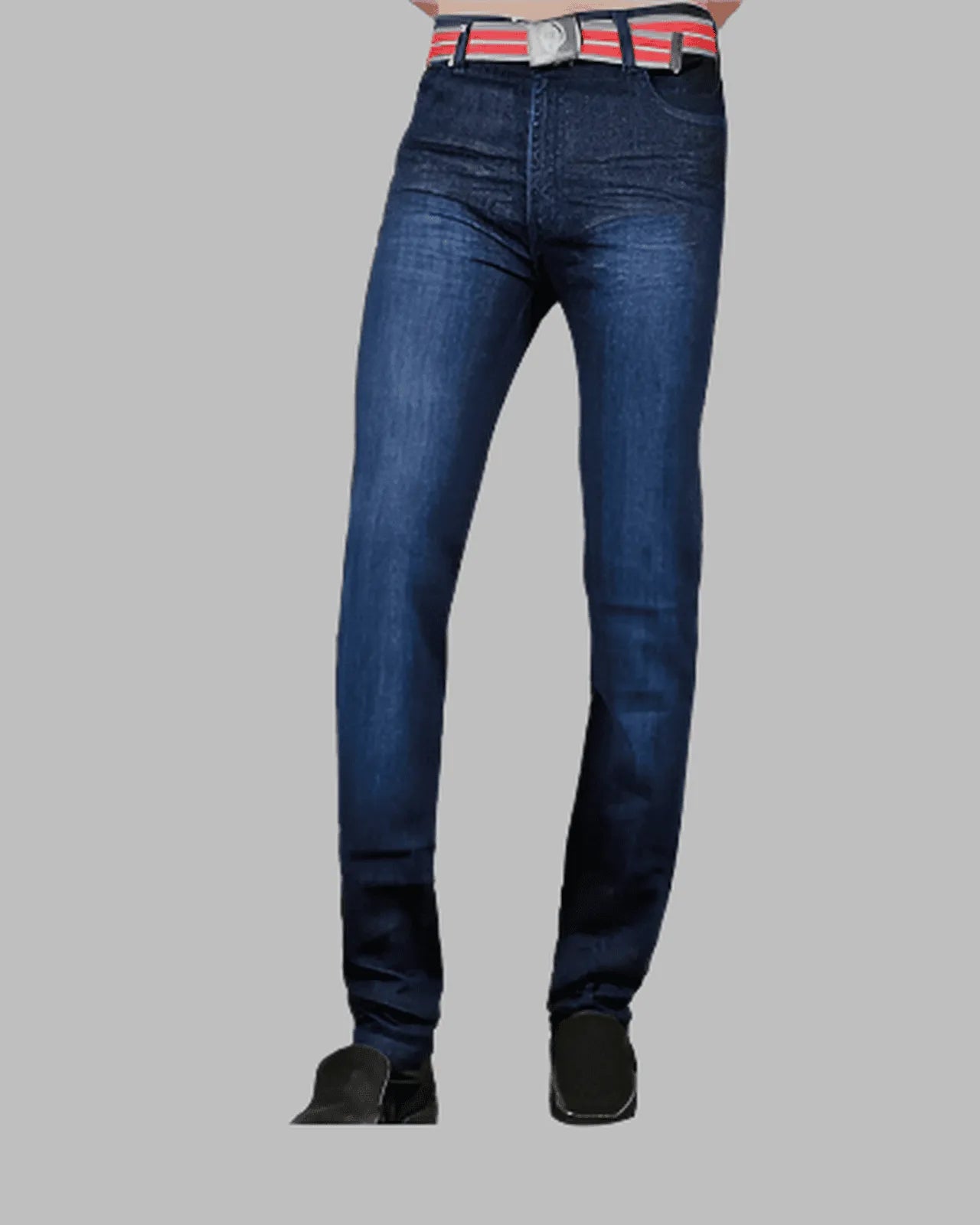 Blue jeans worn by a person on a gray background