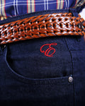 Denim jeans with red embroidered logo and embossed Rivet.