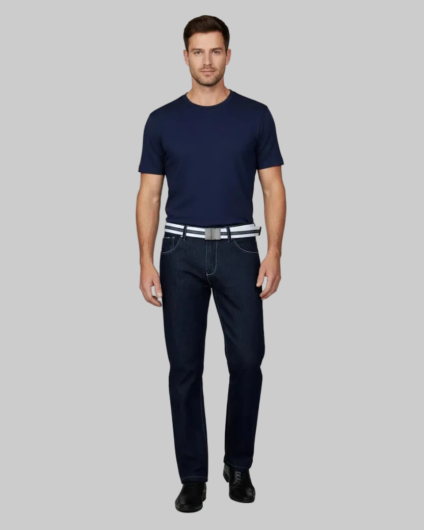 Dark blue jeans worn by a person on a gray background