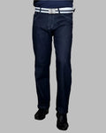 Dark blue jeans worn by a person on a gray background