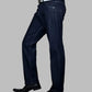 Dark blue jeans worn by a person on a gray background