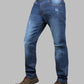 Blue jeans worn by a person on a gray background