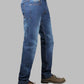 Blue jeans worn by a person on a gray background