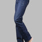 Blue jeans worn by a person on a gray background