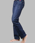 Blue jeans worn by a person on a gray background