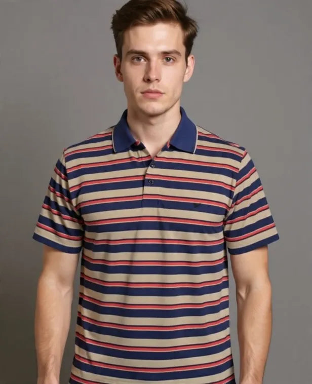 Man wearing a striped polo shirt against a gray background