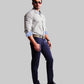 Man wearing a checkered shirt, dark pants, and sunglasses on a white background