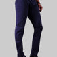 Navy blue pants worn by a person on a light gray background