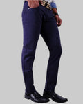 Navy blue pants worn by a person on a light gray background