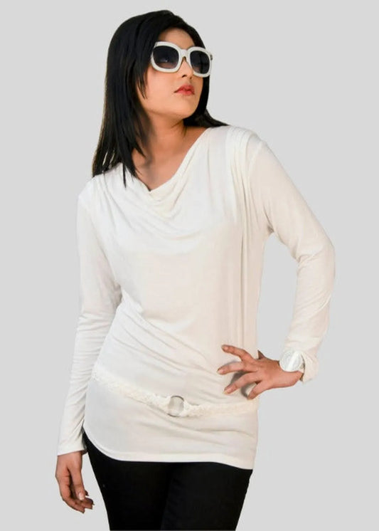 Woman wearing a white long-sleeve top and sunglasses on a plain background