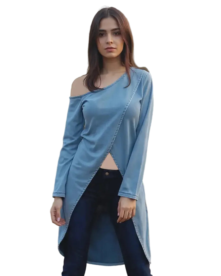 Woman wearing a blue off-shoulder top and dark jeans outdoors.
