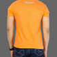Person wearing an orange t-shirt with a logo on the back, standing against a gray background