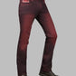 Maroon jeans worn by a person on a gray background