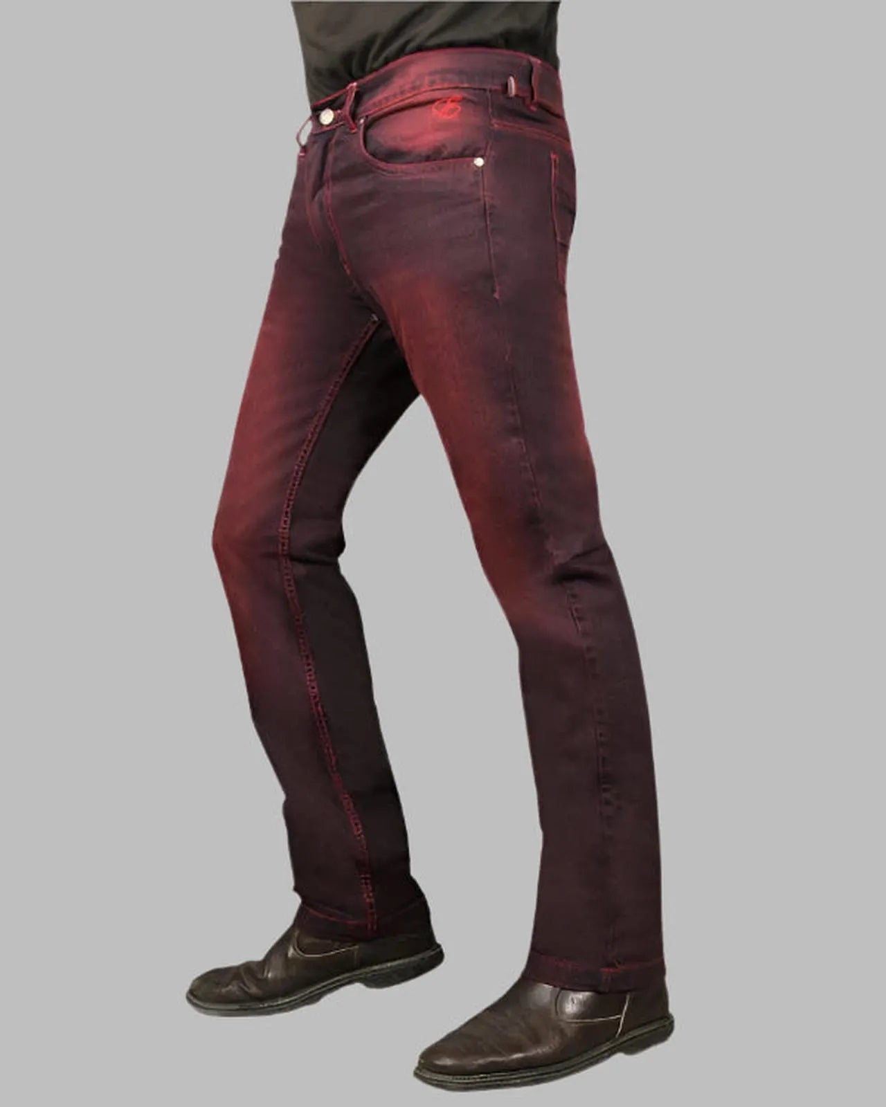 Red jeans worn by a person on a gray background