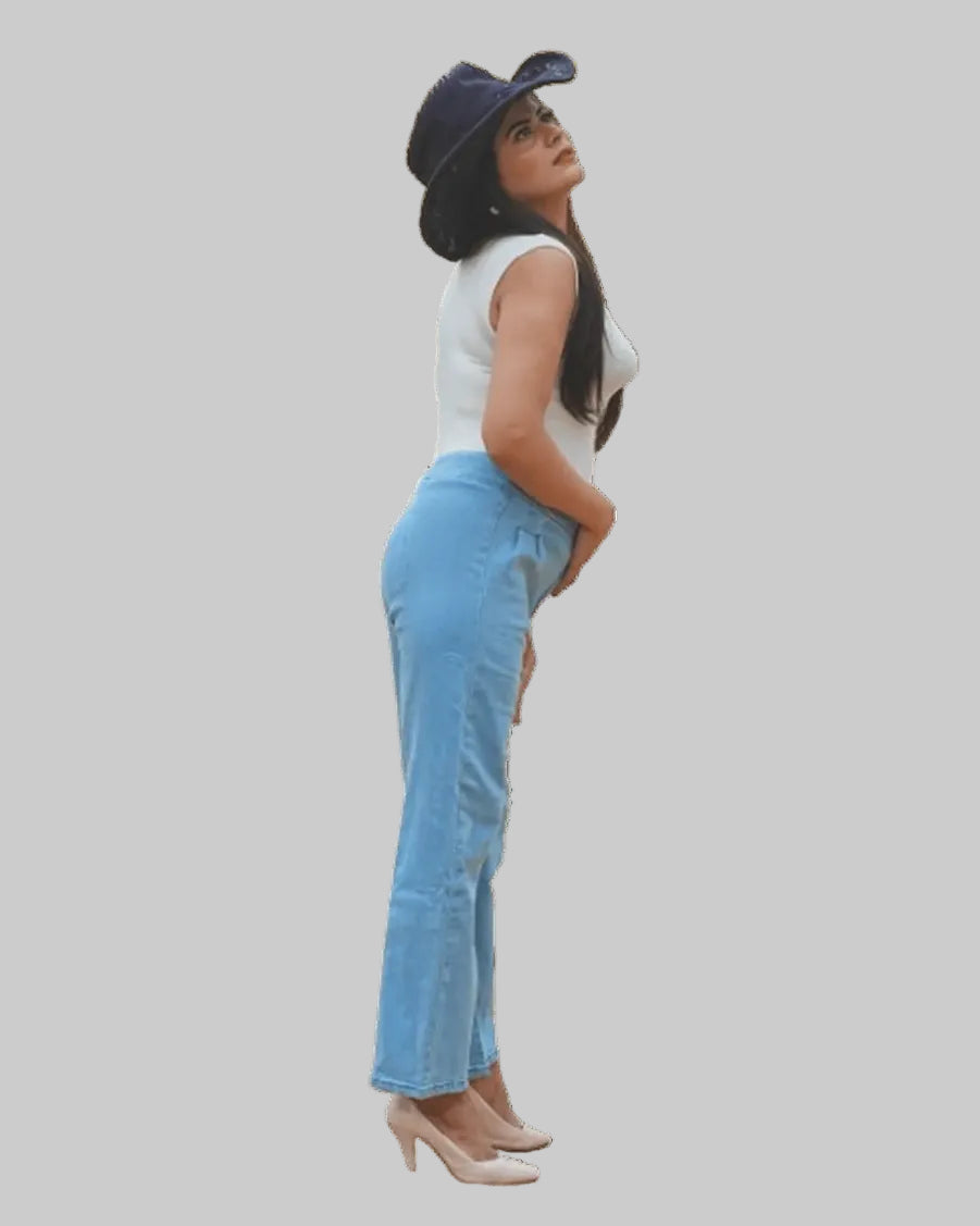 Woman wearing a white top, blue jeans, and a dark hat on a white background